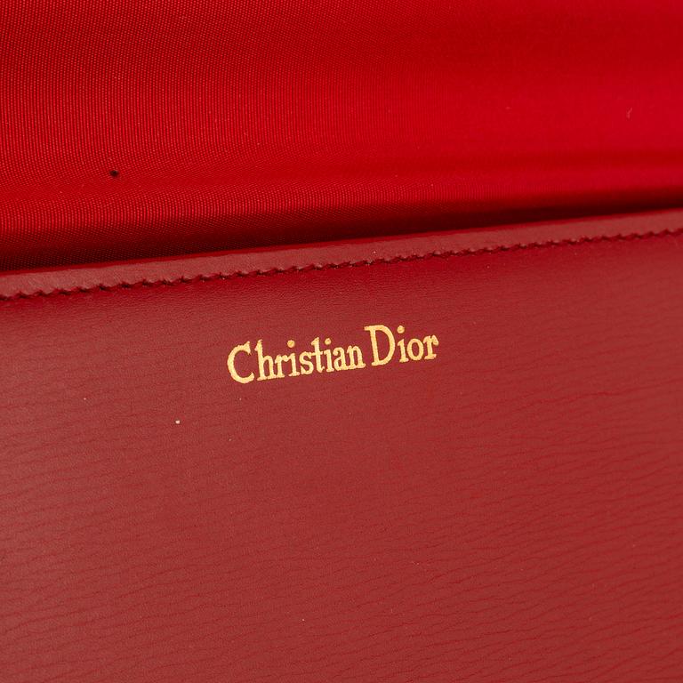 Christian Dior, a red box calf leather clutch.