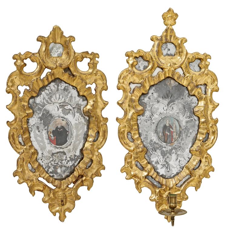 A pair of 18th century Italian one-light girandole mirrors (one candle arm missing).