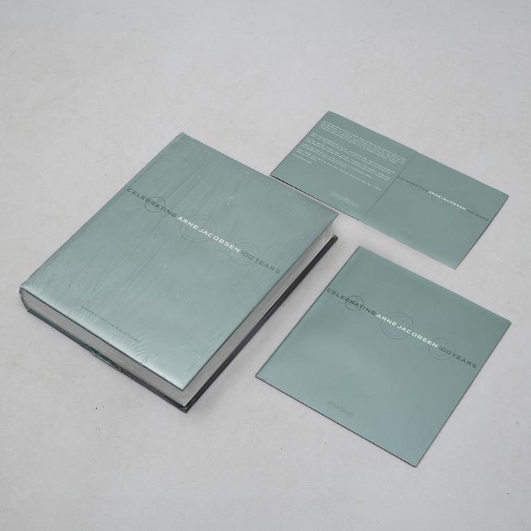 Arne Jacobsen, a 100-year jubilee "Cylinda" stainless steel tea set and a book, Stelton, Denmark, 2002.