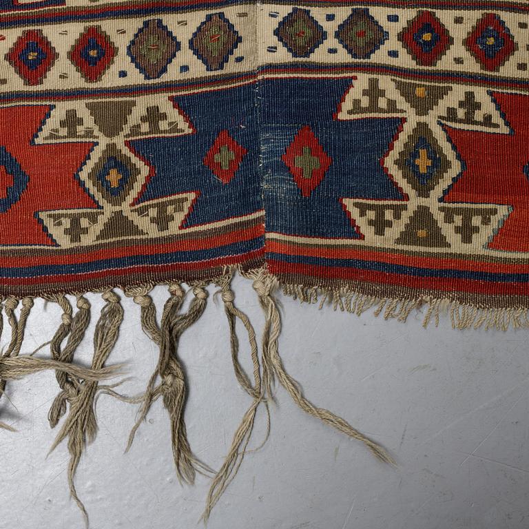 A carpet, a kilim, an antique Anatolian, ca 310-326 x 183,5-192 cm.