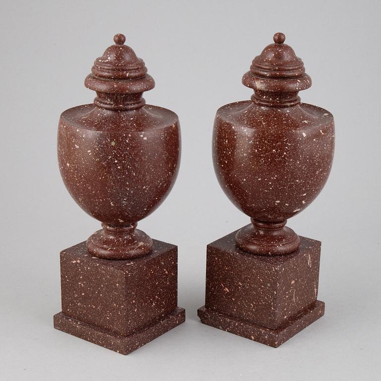 A pair of porphyry urns, presumably first half 20th century.