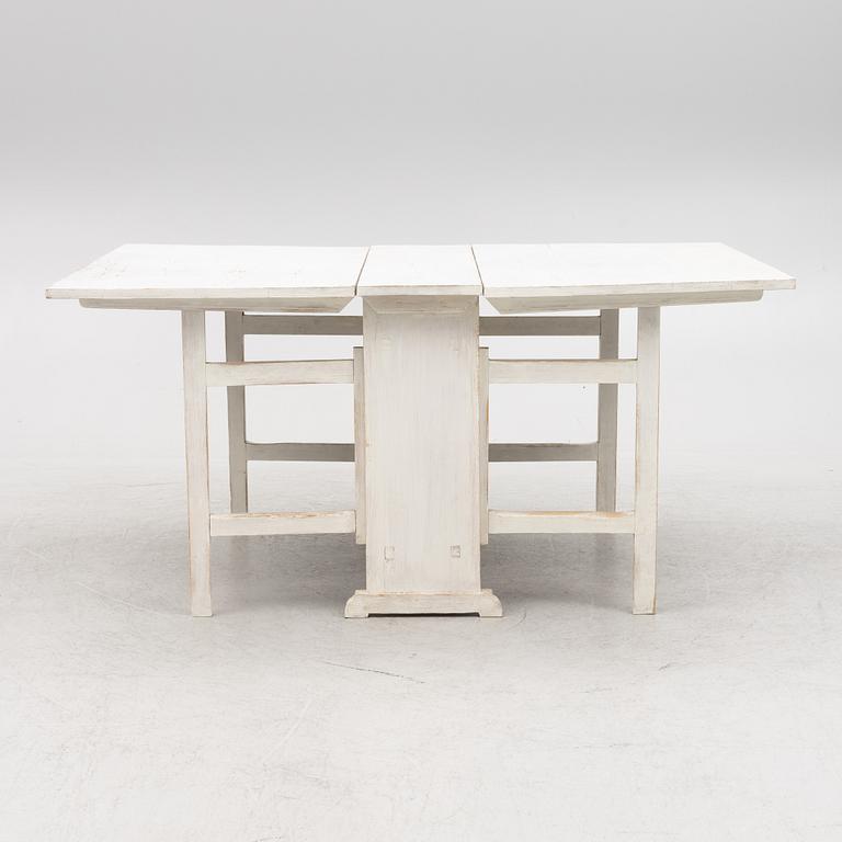 A drop-leaf table, late 19th century.