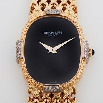 A Patek Philippe Golden Eclipse ladie's wristwatch set with brilliant-cut diamonds. Total carat weigt 0.15 ct. Onyx dial.