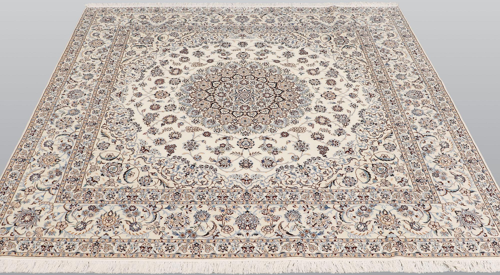 A Nain part silk carpet, 210 x 200 cm.