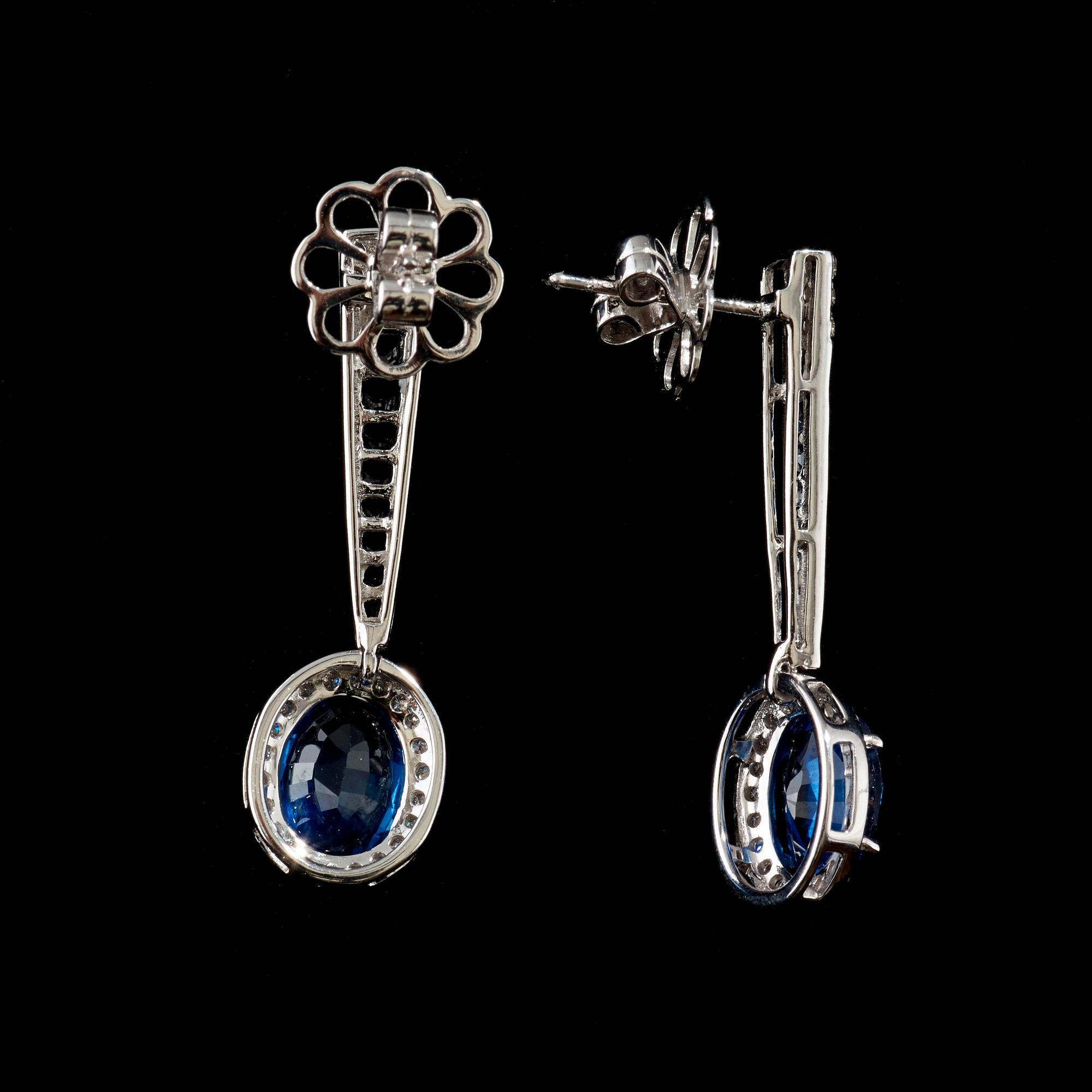 A pair of sapphire and diamond earrings. Sapphire total carat weight 5.63 cts, diamond total carat weight 0.62 ct.