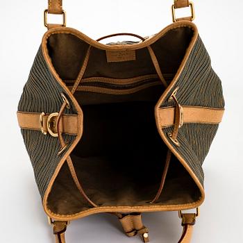 Louis Vuitton, an "Eden Neo" bag.