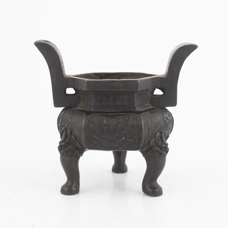 A Chinese bronze tripod censer, Ming dynasty (1368-1643).