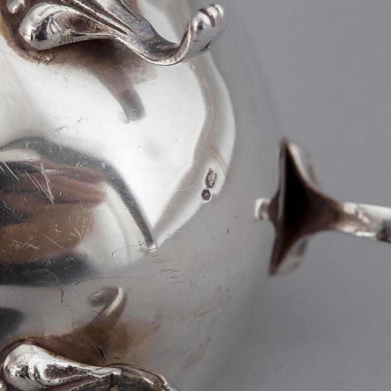 A silver coffee pot, creamer and sugar bowl. Swedish import marks.