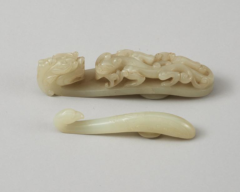 Two carved nephrite belt buckles, Qing dynasty (1644-1912).