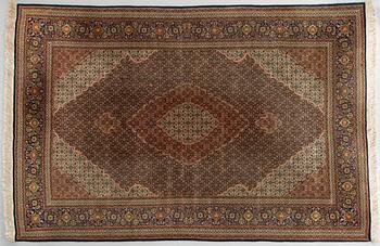 A Tabriz part silk carpet, Mahi, c. 297 x 200 cm.