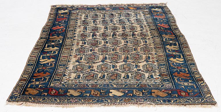 An antique Hamadan rug, c. 188 x 114 cm.