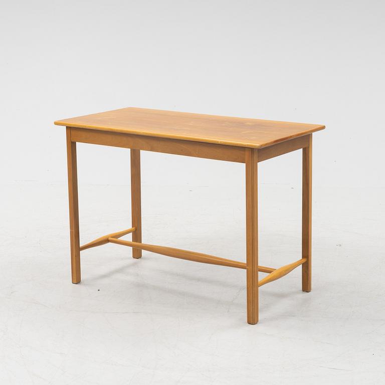 Josef Frank, a model 1106 walnut table, Firma Svenskt Tenn, Sweden.