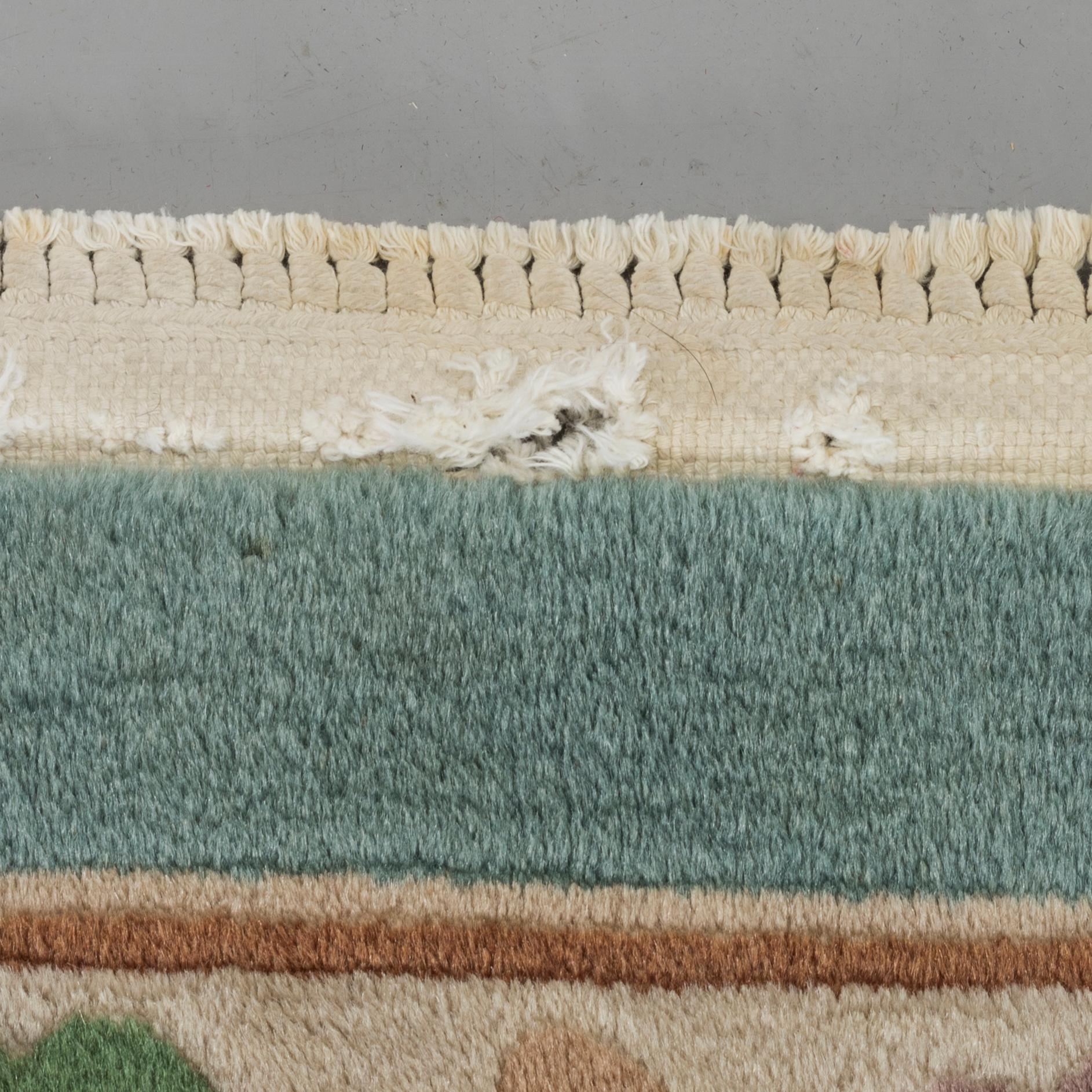 An old Chinese carpet ca 335 x 243 cm.