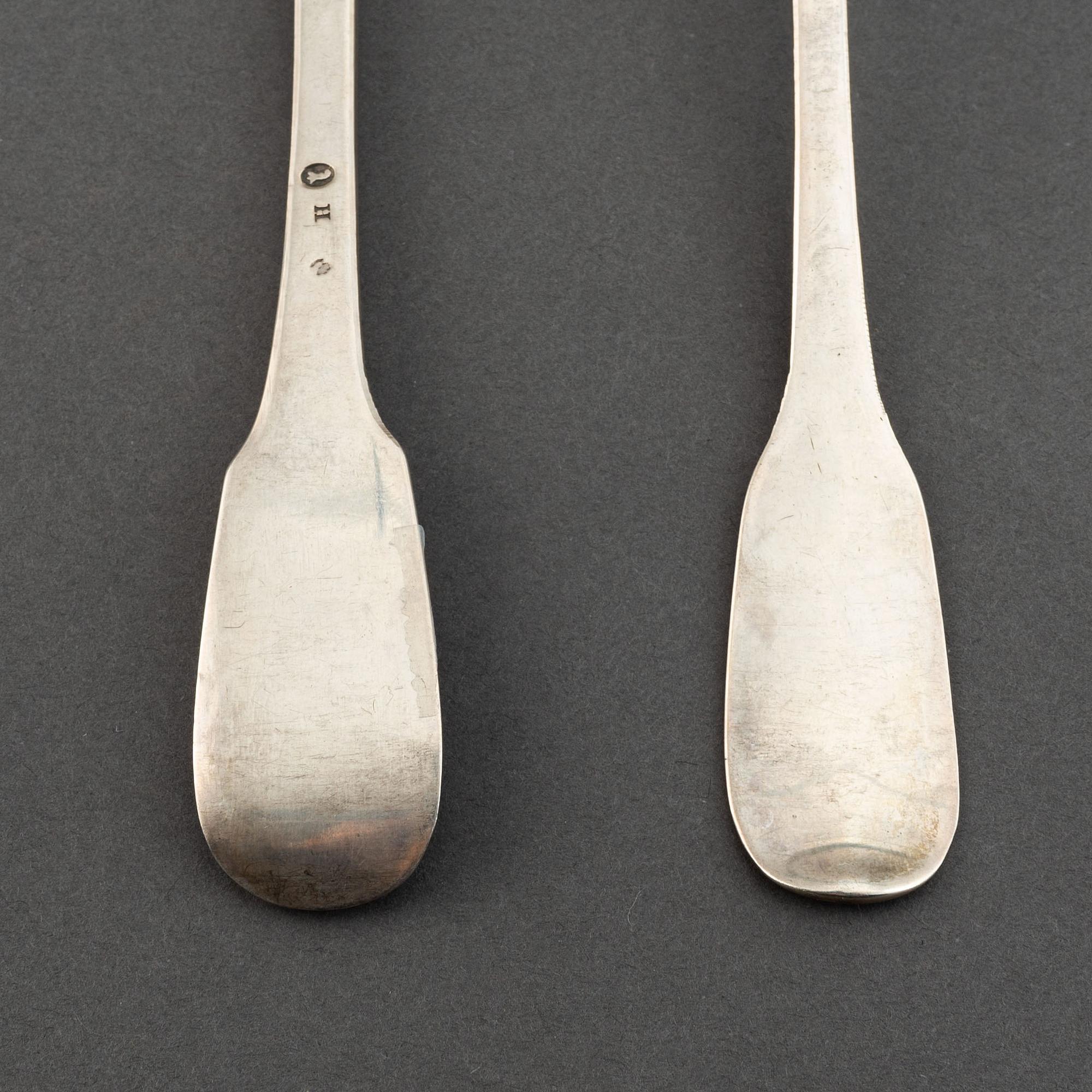 A matched set of nine 18th century silver spoons, marked Basel and Naunur (Belgum).