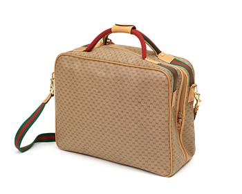 A weekend bag/ travelling bag by Gucci.