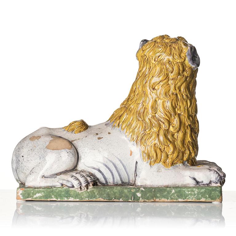 A pair of Luneville recumbent lions, circa 1780-1800.