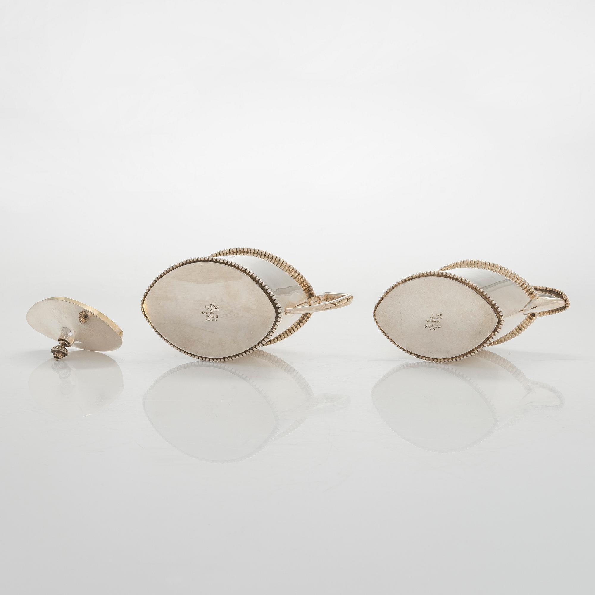 An early 20th century 4- piece sterling silver empire coffee set, C.G. Hallbergs Guldsmeds AB, Stockholm.
