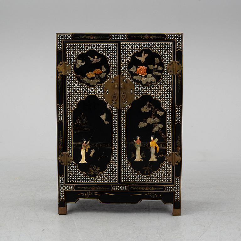 A Chinese black lacquered cabinet, 20th century.