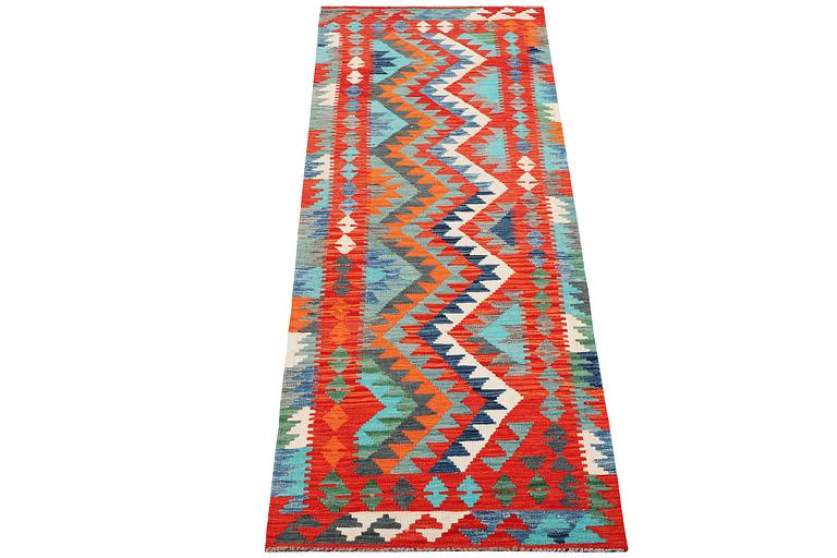 A Kilim runner carpet, c. 297 x 79 cm.