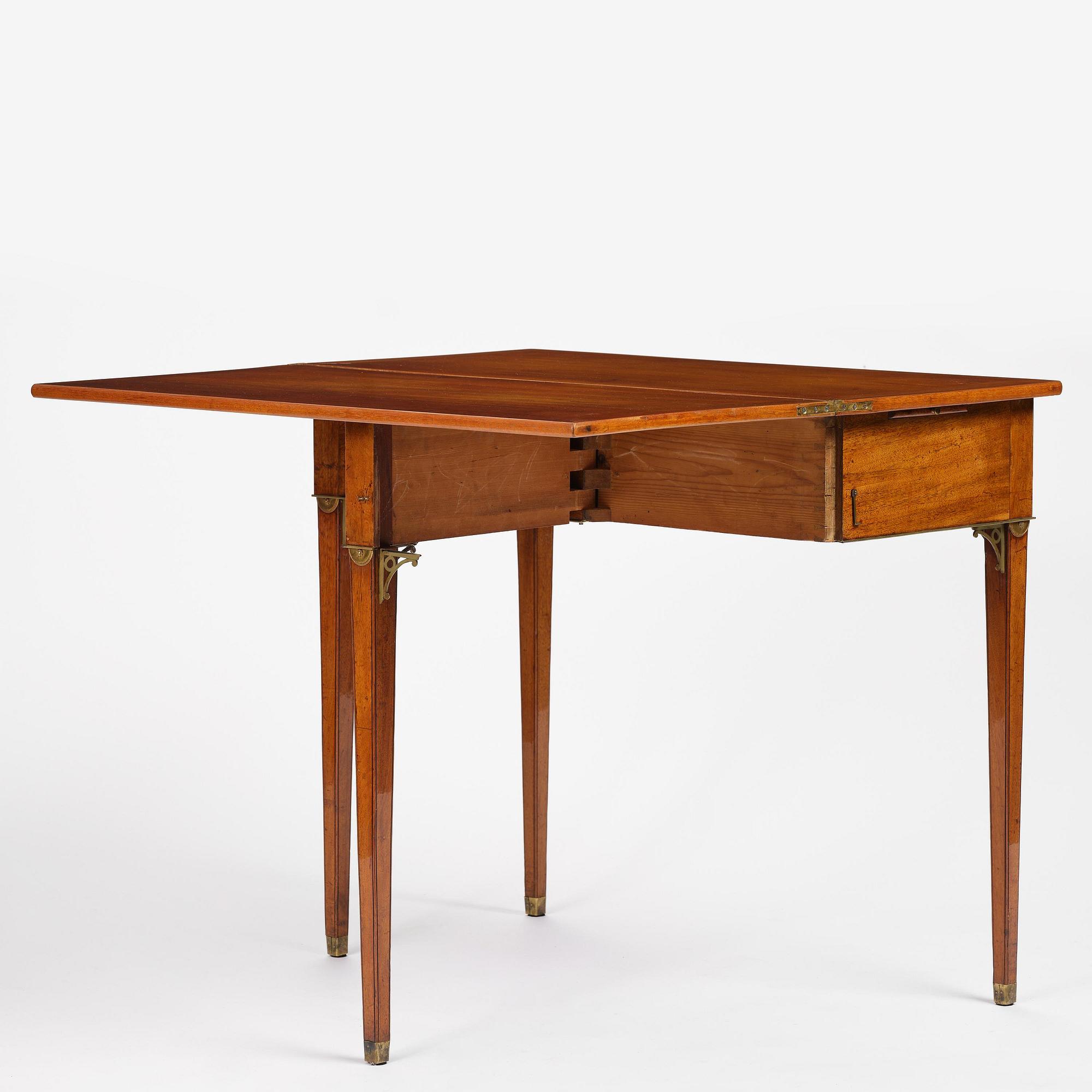 A late Gustavian mahogany games table, presumably by A. Nordström (Journeyman at G. Iwersson 1806-09).