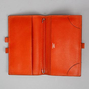 Hermès, scarf and leather cover.