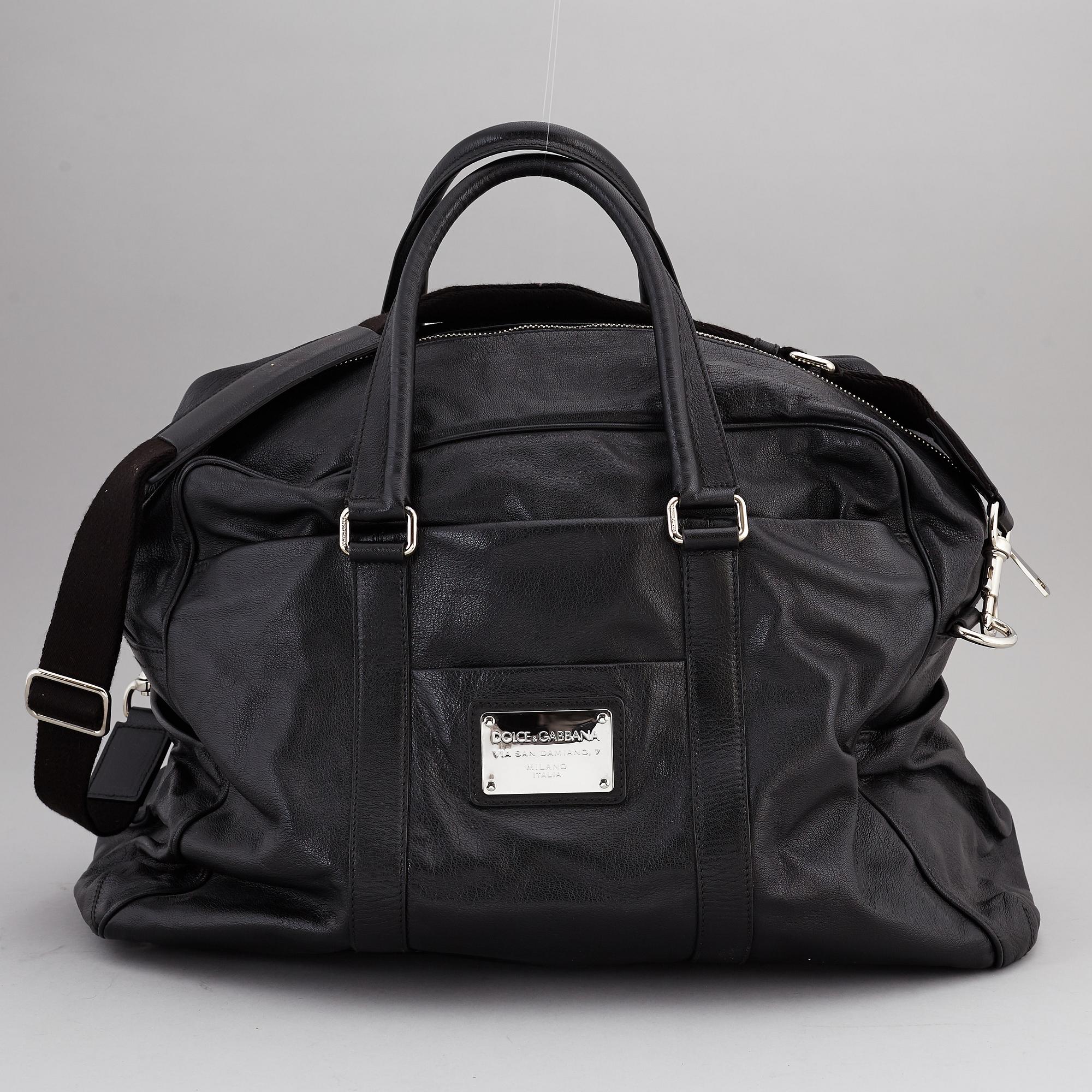 DOLCE & GABBANA, a black leather weekend bag, 2009.