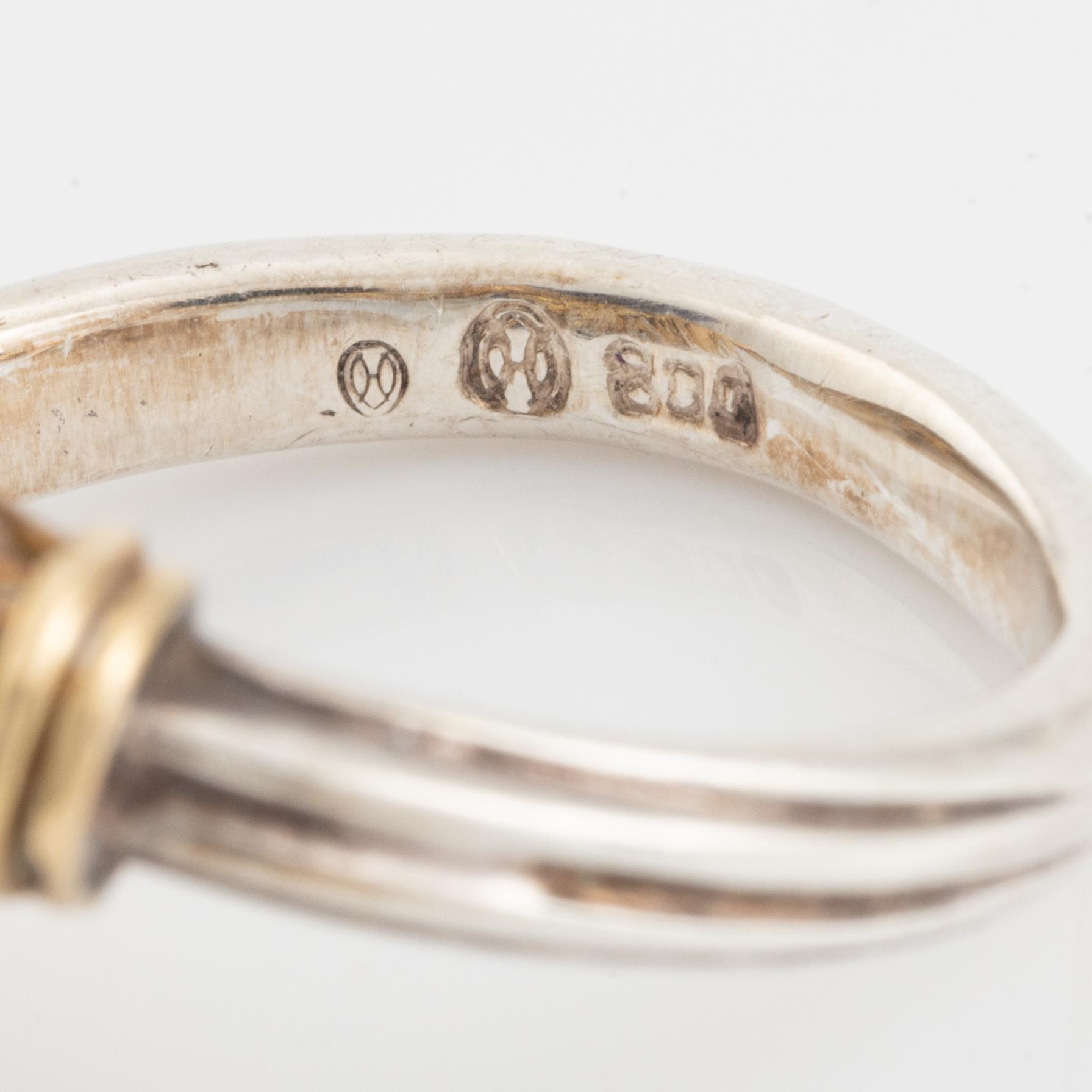 An Ilias Lalaounis ring in silver and 18K gold with sodalite.