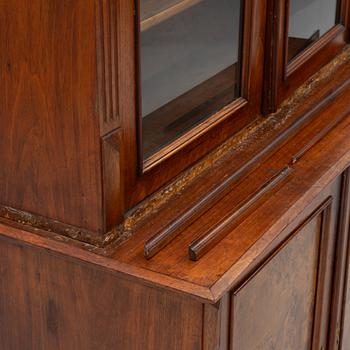A two part mahogany cabinet, around 1900.