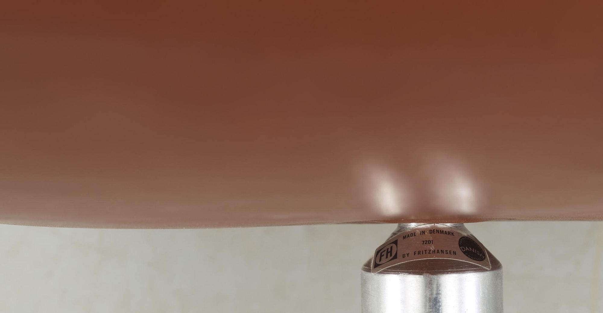 A pair of Arne Jacobsen brown leather 'Swan' chairs, Fritz Hansen, Denmark 1972.