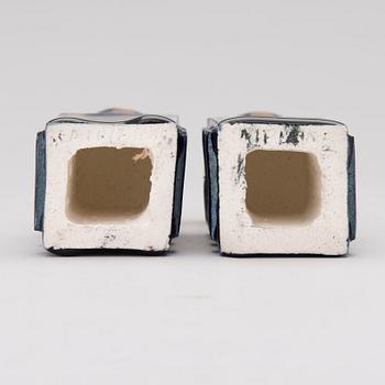 A pair of ceramic candlesticks signed Kaipiainen.