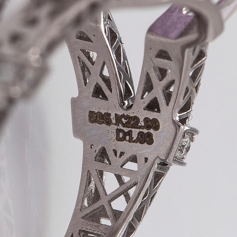 A 14K gold ring with kunzite and diamonds.