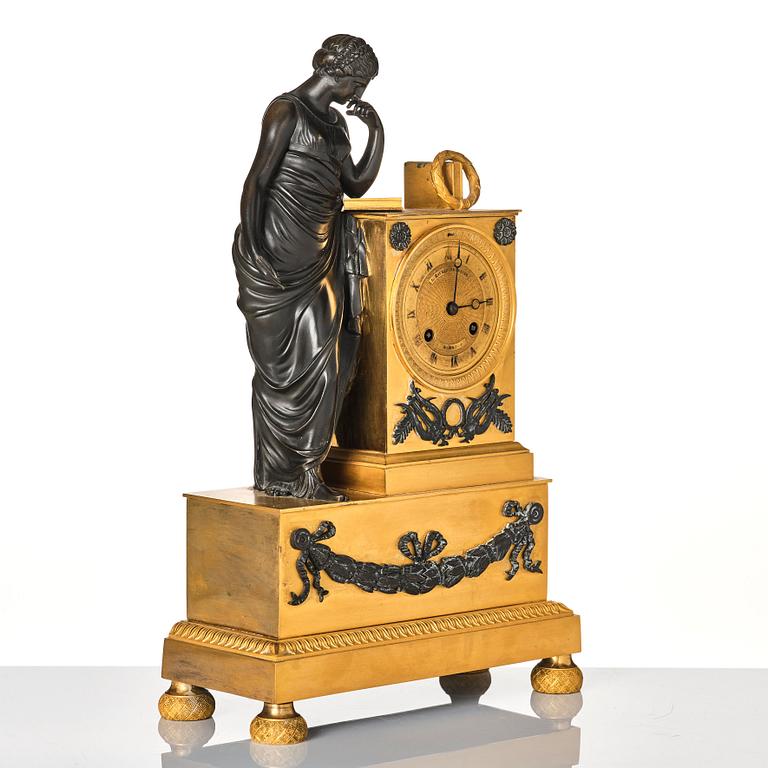 A French Empire early 19th century mantel clock, by Antoine André Ravrio.