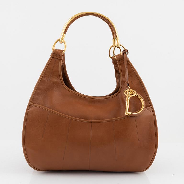 Christian Dior, a brown leather handbag.