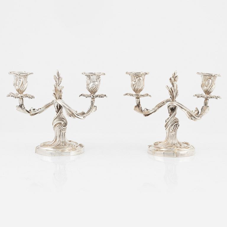 A rococo style pair of silverplated candelabras, end of the 19th Century..