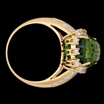 A cushion cut peridote, 9.63 cts, and brilliant dut diamond ring, tot. 0.68 cts.