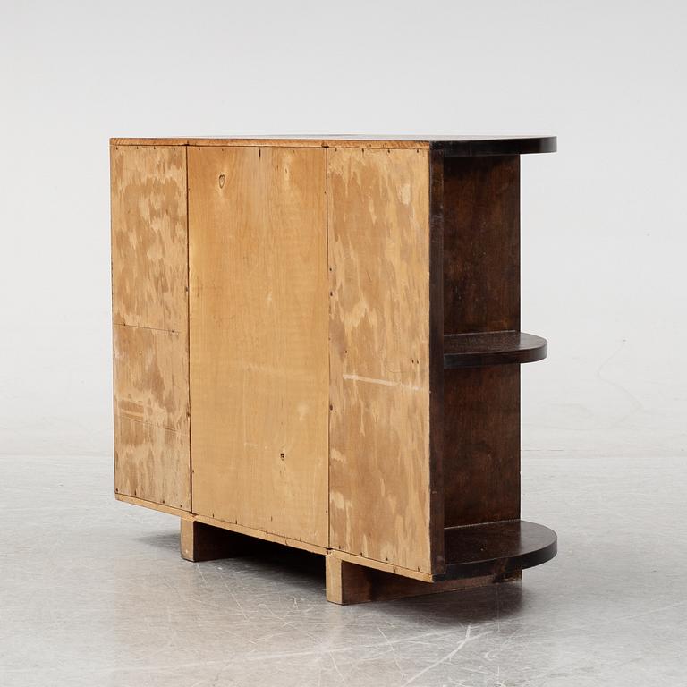 A stained birch chest of drawers and mirror, 1930's.