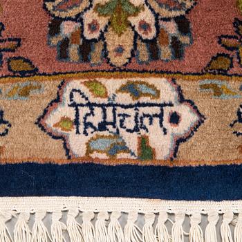 A signed rug, oriental, ca. 242 x 168 cm.