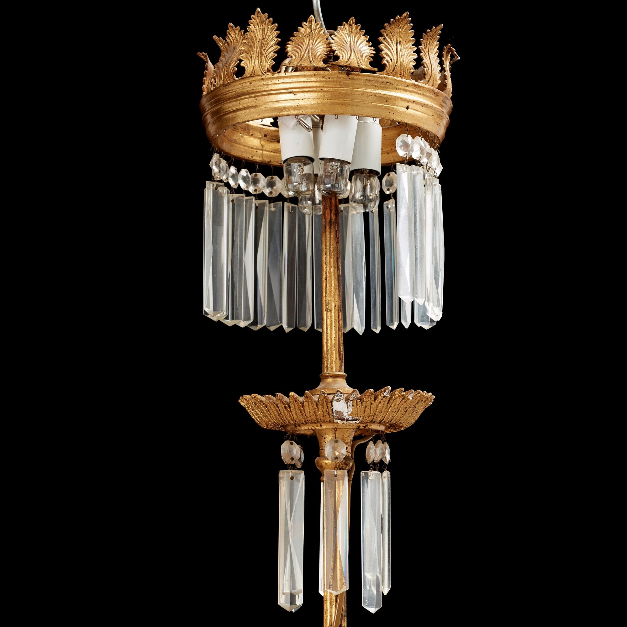 A German 19th century eight-light chandelier in the manner of Karl Friedrich Schinkel.