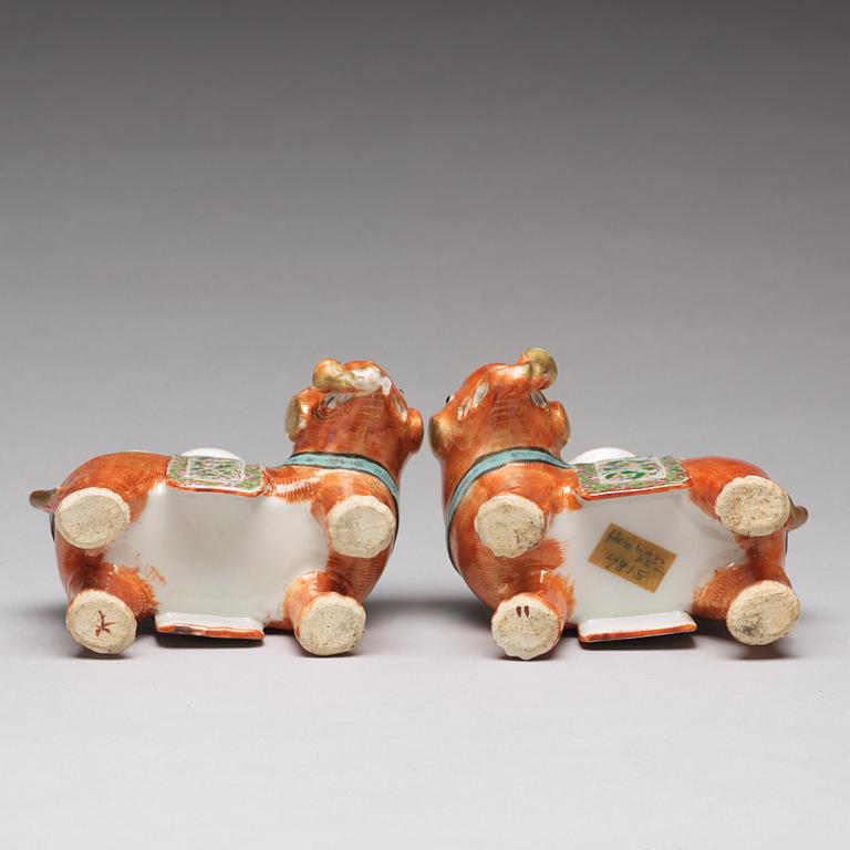 A pair of famille rose Canton elephant candle holders, late Qing dynasty, about 1900.