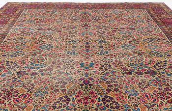 An antique 'Millefleur' Kerman Laver carpet, ca 434 x 321 cm.