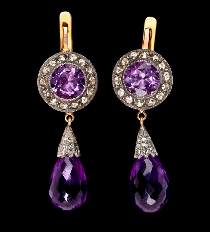A pair of amethyst and diamond ear pendants.