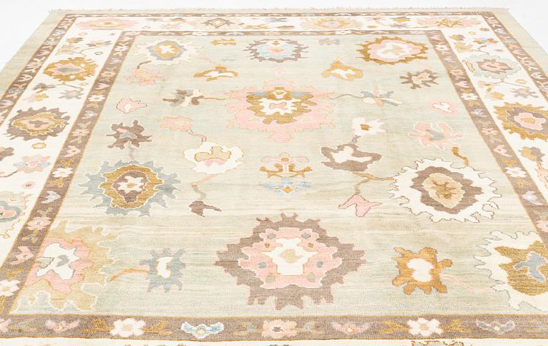 A Sultanabad/Ushak design carpet, signed Halil, c. 389 x 295 cm.