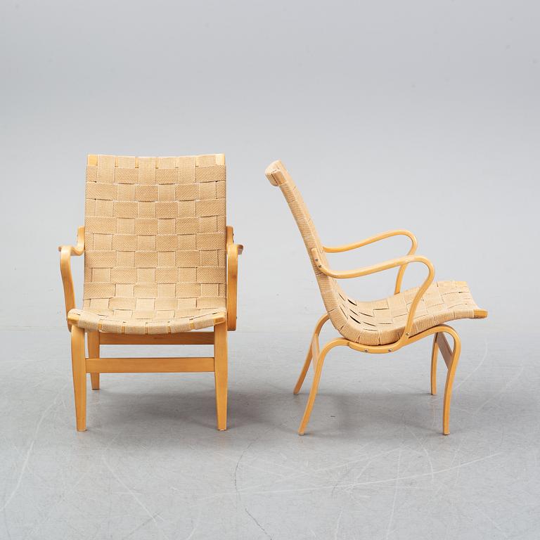 A pair of 'Eva' easy chairs by Bruno Mathsson for Firma Karl Mathsson, dated 1974.
