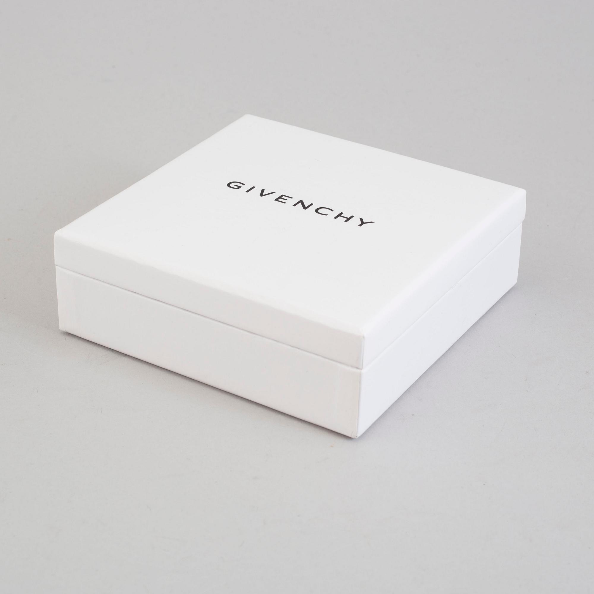 a Givenchy 'Shark tooth' necklace.