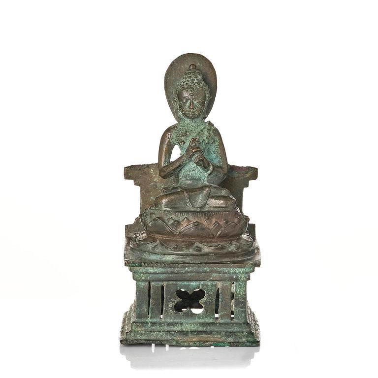 A bronze Buddha Vairocana, Eastern Java, 10th century.