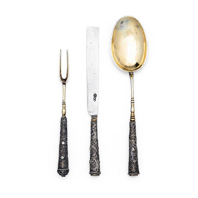 A possibly German 17/18th century parcel-gilt silver and filigree three-piece travel cutlery, unmarked.