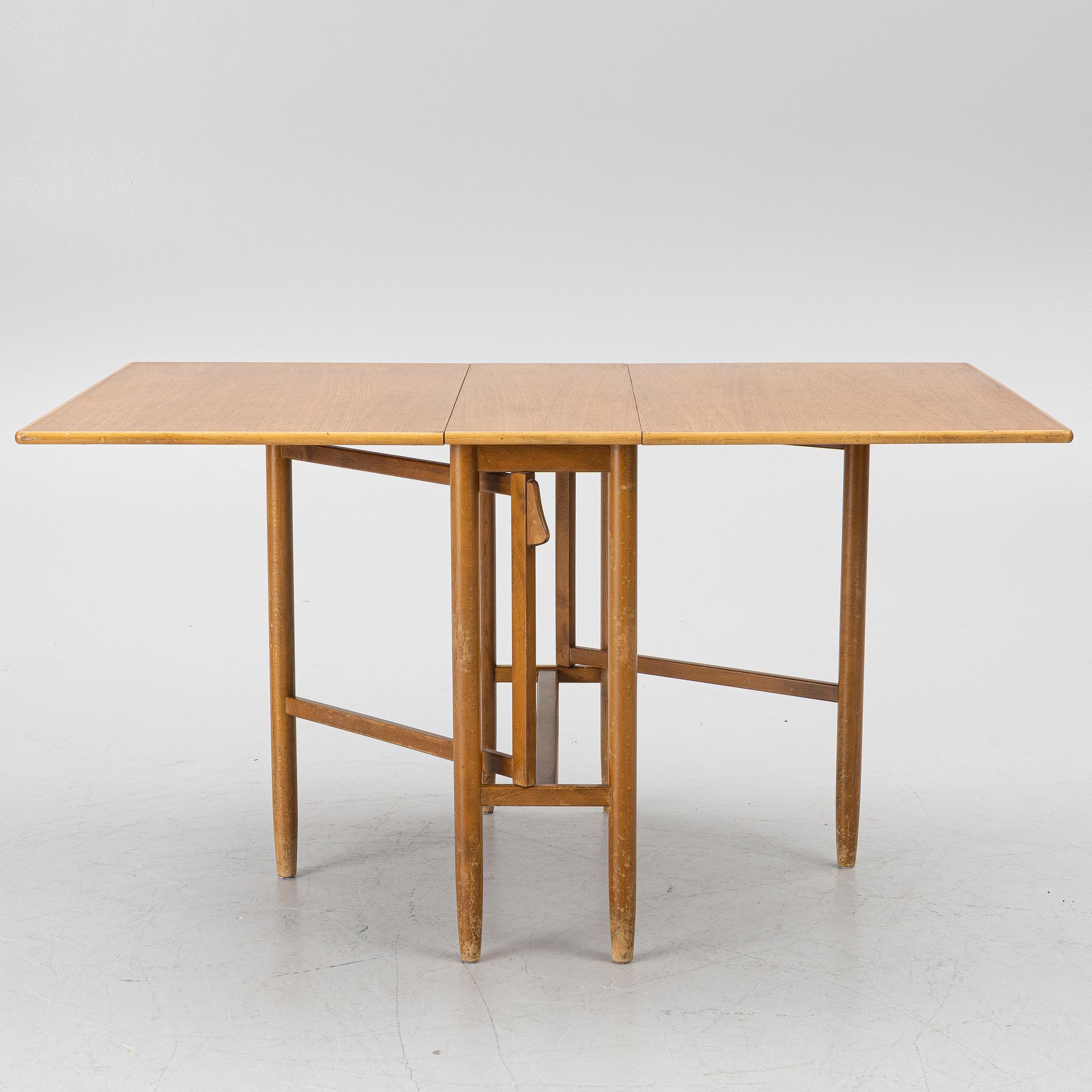 A mid20th century gate-leg table.