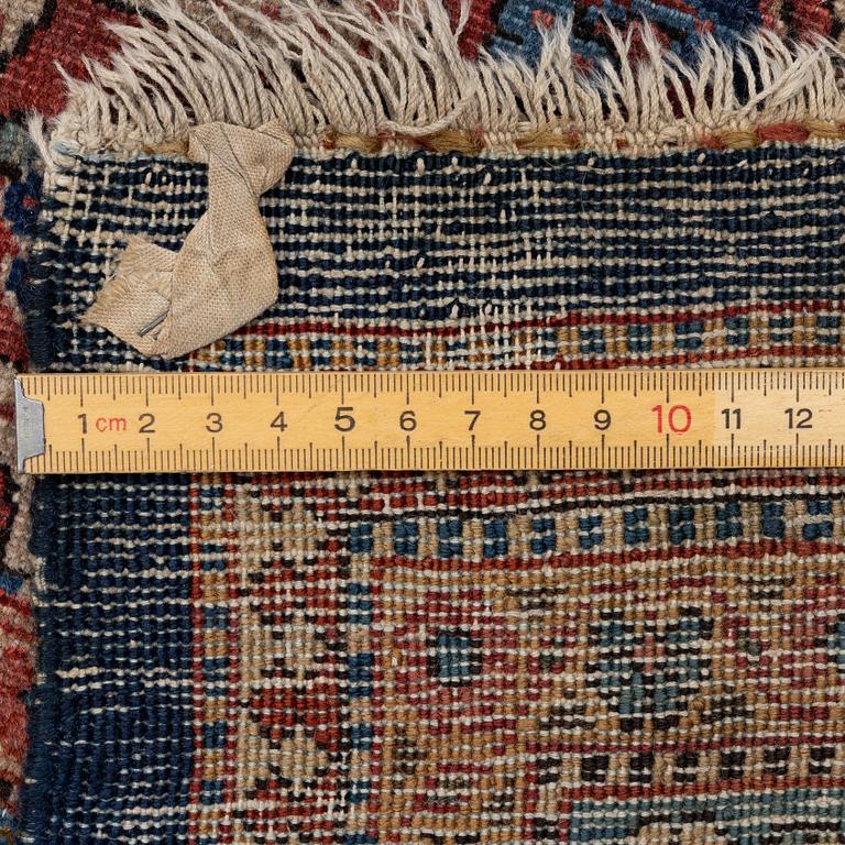 An oriental carpet, c. 425 x 305 cm.