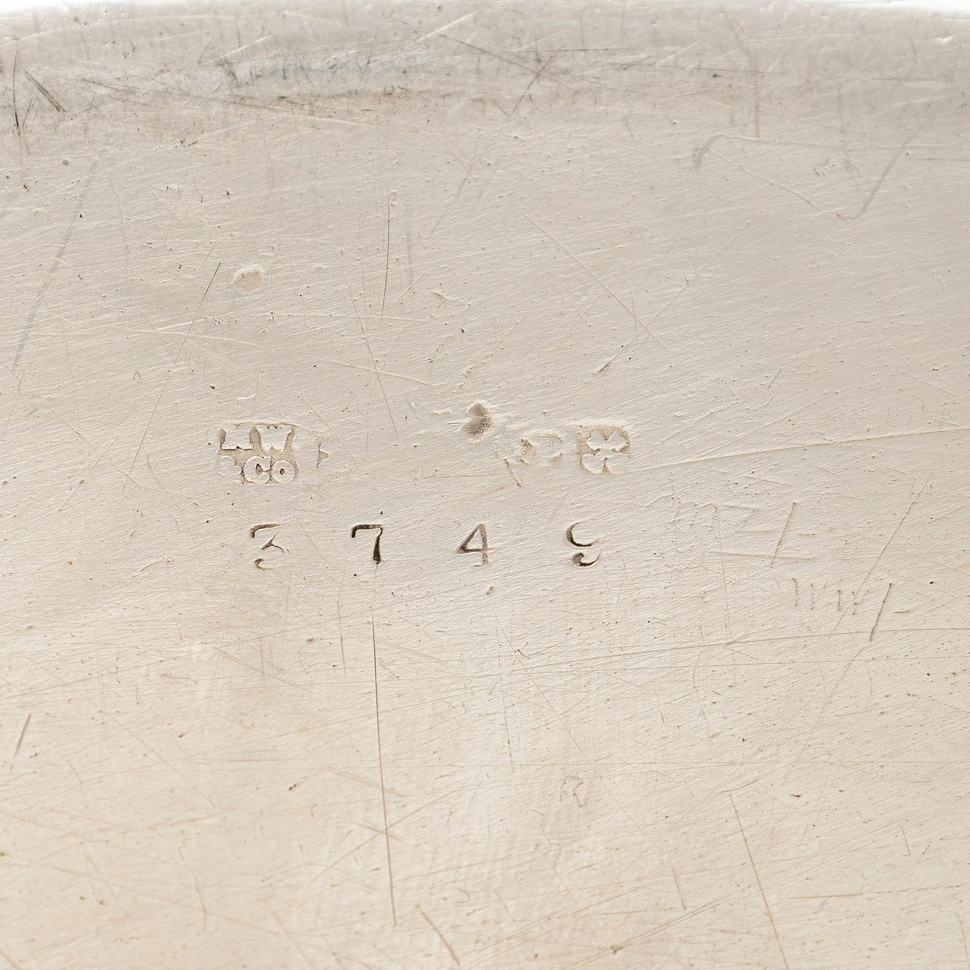 A set of four silver plated entree dishes, England.