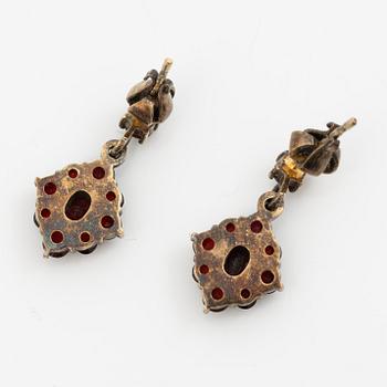 Pendant and a pair of earrings, gilt metal with garnets.
